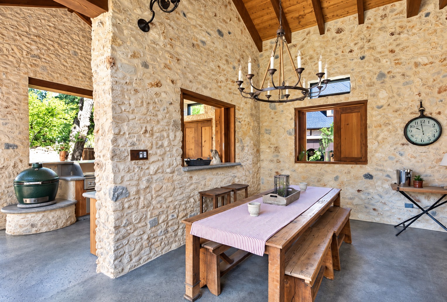 Covered stone pavilion with outdoor dining table