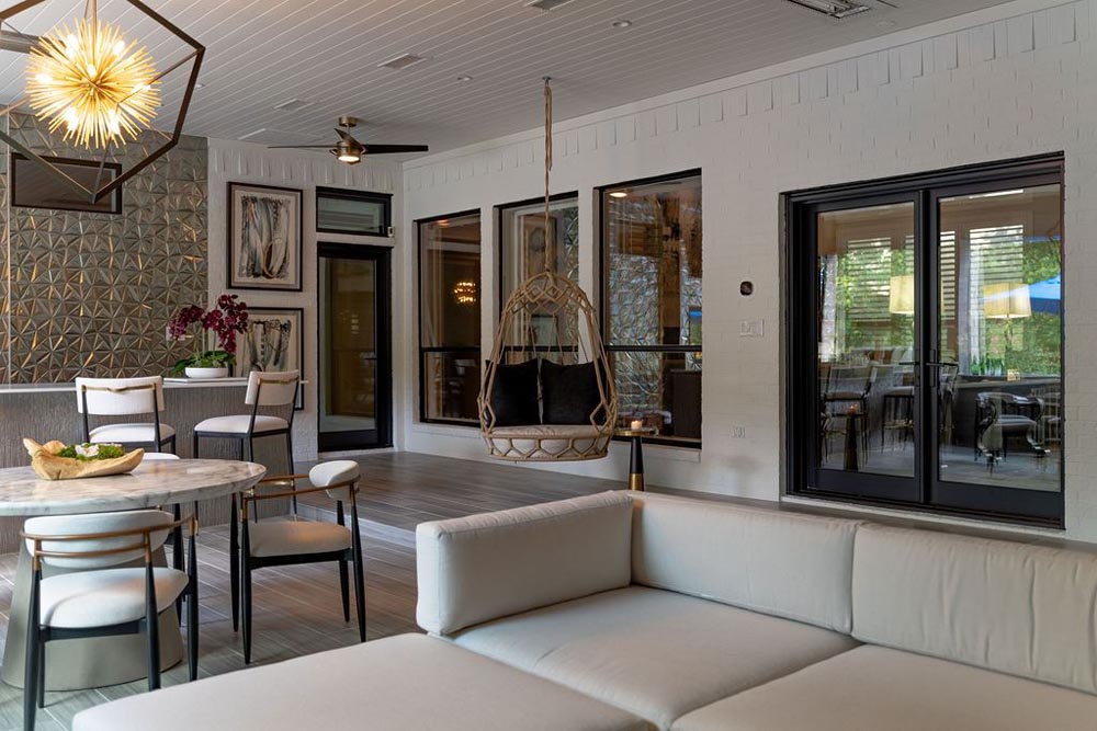 Covered lounge and dining area opening to patio