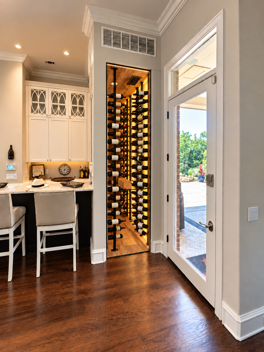 Stocked wine room viewed beside the exterior door
